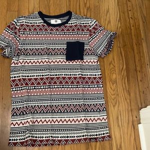 Black and Red Aztec print shirt. With black pocket